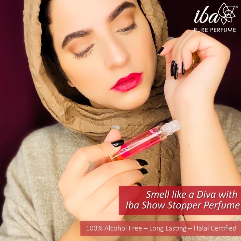 Women Displaying Iba Pure Perfume - Show Stopper