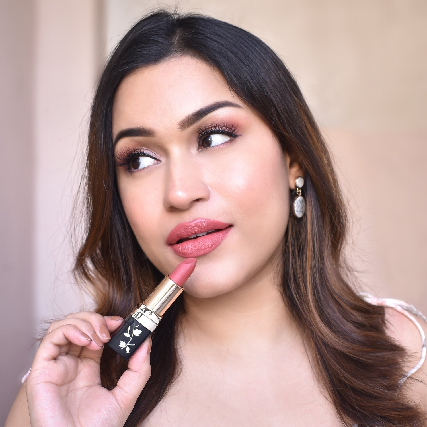 A Girl Putting Lipstick