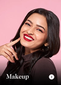 Woman with red lipstick posing against a pink background with 'Makeup' text.