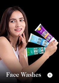Woman holding multiple face wash products with a black background